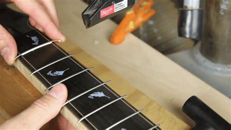 How to Fix Fret Buzz on Acoustic Guitar: And Why Bananas Might Be the Secret to Perfect Tone